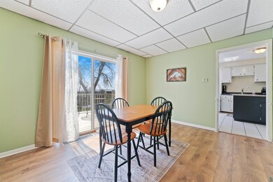 Tiled dining space featuring a paneled ceiling