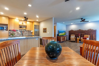 There is a lovely juxtaposition of the warm-toned vertical grain bamboo cabinetry with the richly