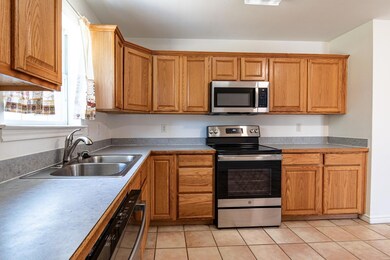 Kitchen with sink, stainless steel appliances, and