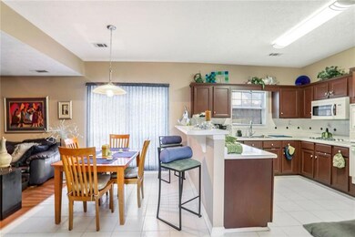 Kitchen featuring pendant lighting, white applianc