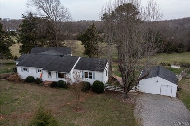 Aerial view of the home and outbuildings