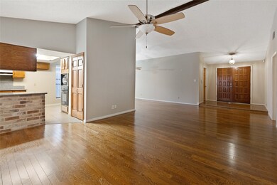Wood floors throughout the main dining and living