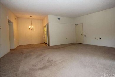 View of living room showing dining area and kitche