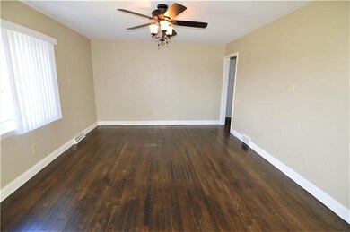 A view of the good sized living room from the fron