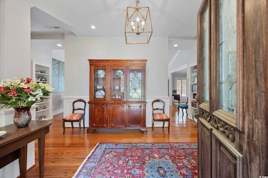 Foyer entrance featuring a notable chandelier, wai