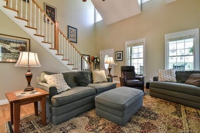 Sweeping Staircase to Upper Level...Great Natural 