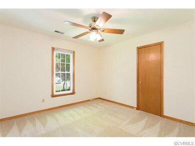 Front center Bedroom with ceiling fan.