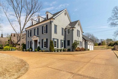 3 car garage, parking pad and circle drive