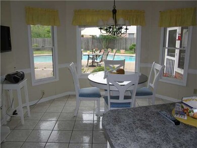Kitchen with view overlooking pool