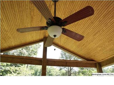 Nice cathedral ceiling with fan on porch