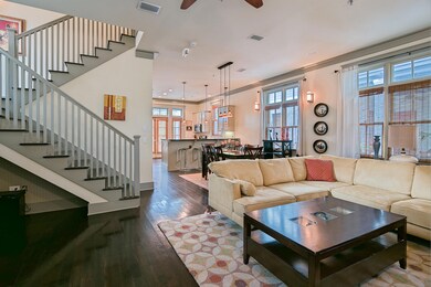 Living area open to dining and kitchen
