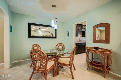 DINING ROOM SHOWS KITCHEN ENTRY