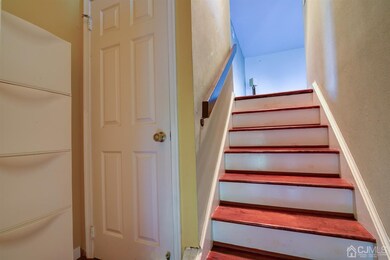Wooden Stairs with Coat Closet and Extra Shelves.