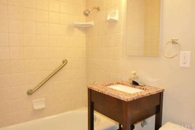 Custom Granite Vanity in Ceramic Tile Bathroom.