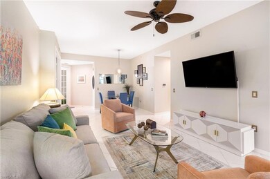 Tiled living room with ceiling fan