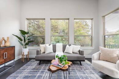Living area featuring baseboards and wood finishe