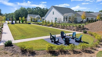 View of property's community featuring a fire pit