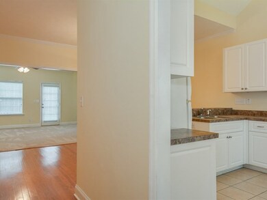 Foyer View of Kitchen, DR, GR