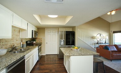 KITCHEN VIEW:  The door at the end of the kitchen