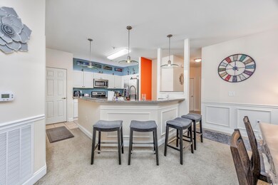 Kitchen with white cabinetry, stainless steel appl