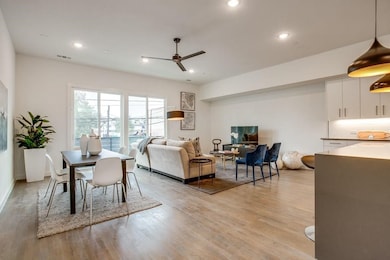 Living room featuring ceiling fan, recessed lighting, and light wood-type flooring