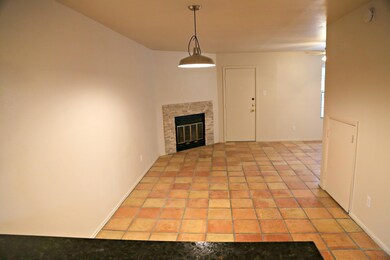 Unfurnished living room featuring ceiling fan, a 