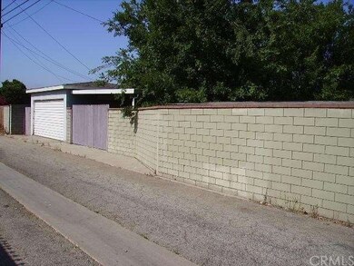 Rear alley access to garage and carport/patio