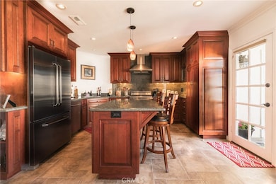 Glass door leading out to the very private back patio and two car garage. The laundry room is just outside that door.