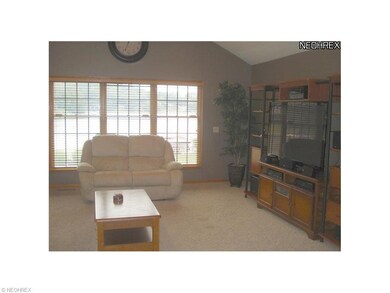 Living room with vaulted ceiling and excellent lak