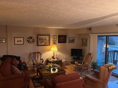 Living room is nice and bright with large patio do