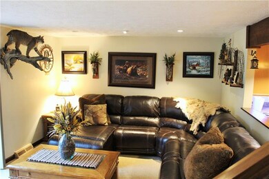 Cozy living room, neutral paint and carpeting welc