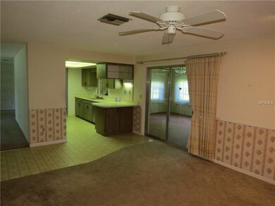Family room open to kitchen with sliders to Florida Rm under air