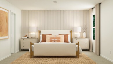 Carpeted bedroom featuring baseboards
