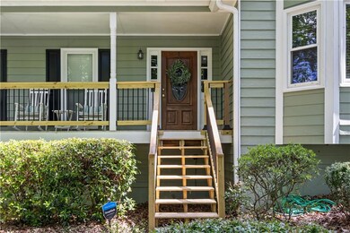 Entrance to property featuring covered porch