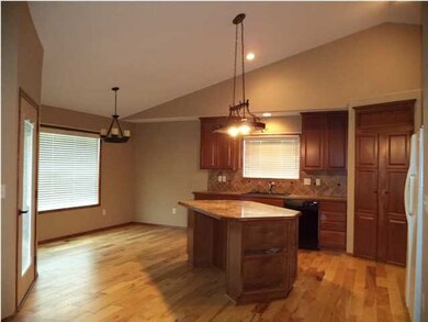 Hard wood floors and neutral decor with a view.