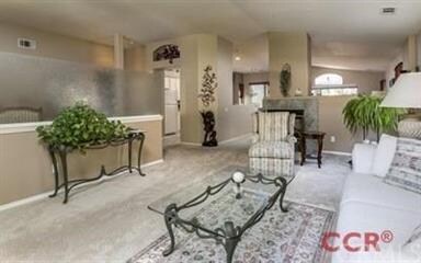Living Room adjacent to office space behind privac