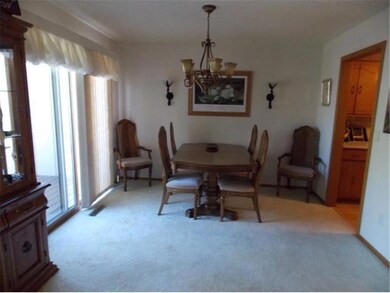 Separate dining area walks out to a large deck.