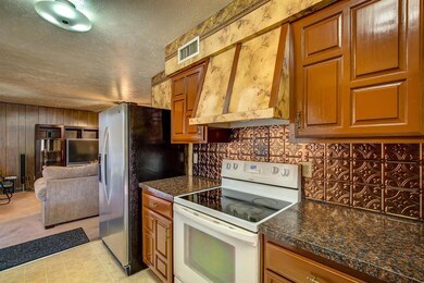 Galley kitchen open to living and formal dining ro