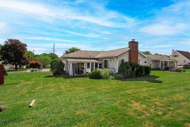 The back has a deck and a sunroom off the back of
