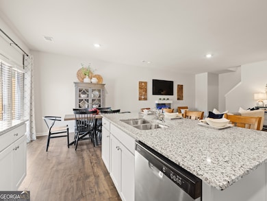 sudbury townhome kitchen with white cabinets and granite countertops at mountain park in dahlonega georgia