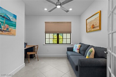 Living area with light tile patterned flooring, ba