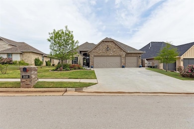 View of front of home featuring a garage, driveway