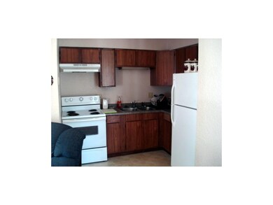 Efficient kitchen with newer stove, refrigerator, 
