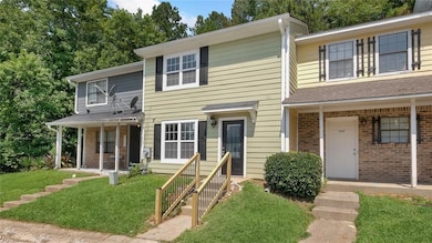 Townhome / multi-family property with brick siding