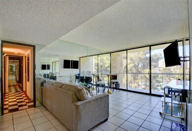 Living area featuring light tile patterned floors,