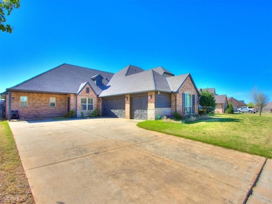 View of front of house featuring a garage, roof wi