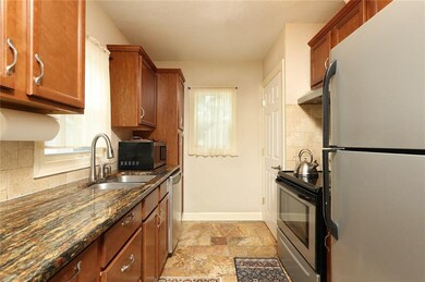 Granite, SS, and tile in kitchen