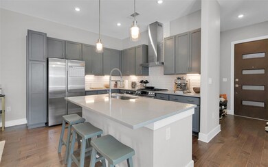 Kitchen featuring dark wood finished floors, a br