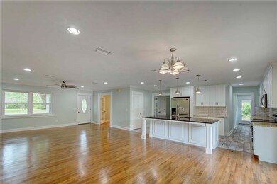View of family room looking back to front.  Also,