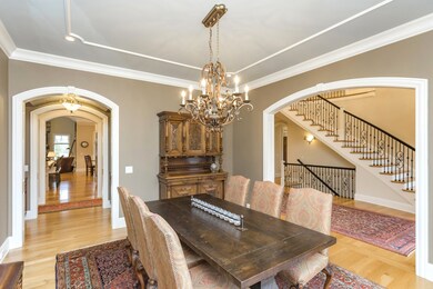 Beautiful hardwood floors, seen here in the formal dining room, are throughout the main level. 
